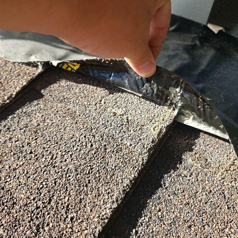Shingle lifting for inspection near swamp cooler seal Shingle lifting for inspection near swamp cooler seal