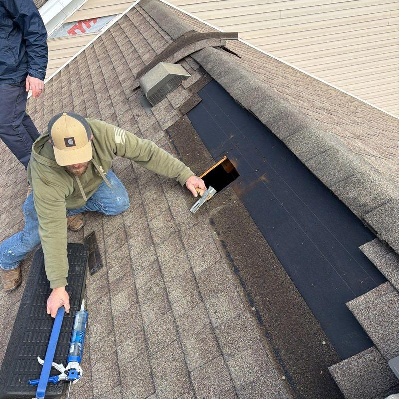 Roof shingles and ventilation inspection on pitched roof