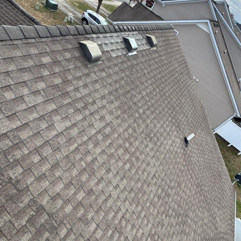 Asphalt shingle roof with vent pipes and flashing