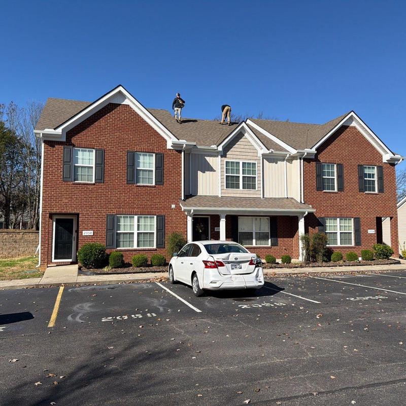 Asphalt shingle roof with ridge cap inspection