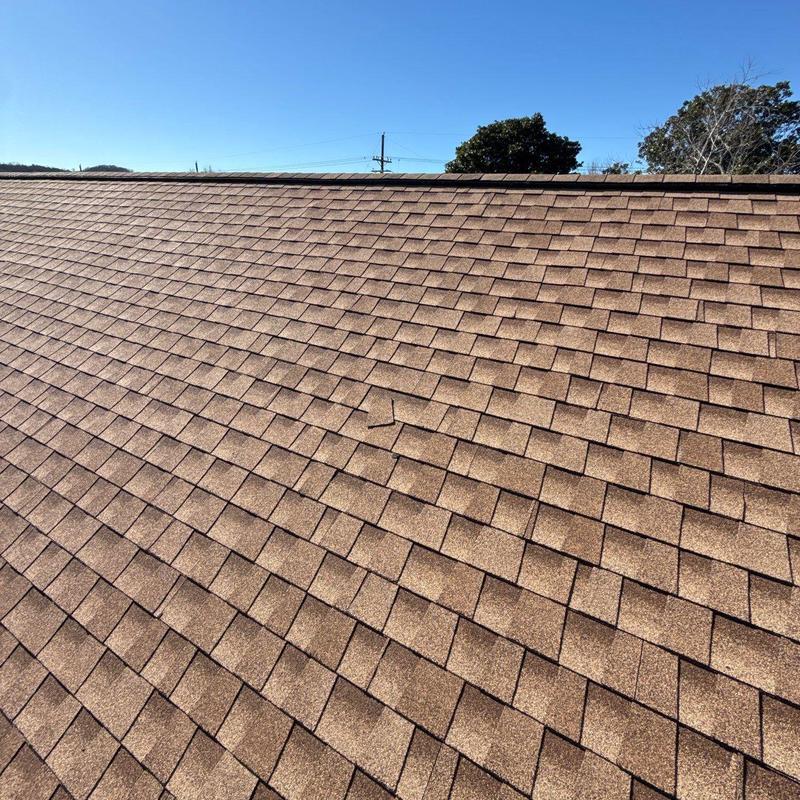 Roof shingles with hail damage on residential roof