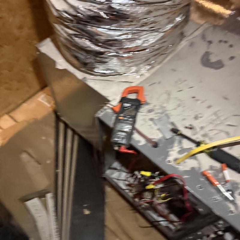 Air handler electrical panel with clamp meter testing Air handler electrical panel with clamp meter testing