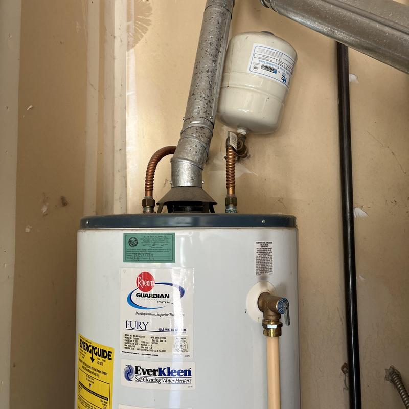Gas water heater with expansion tank and vent pipe