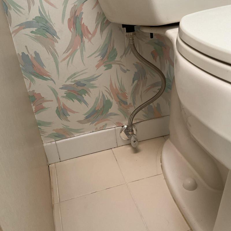 Toilet angle stop and supply line installation near wall