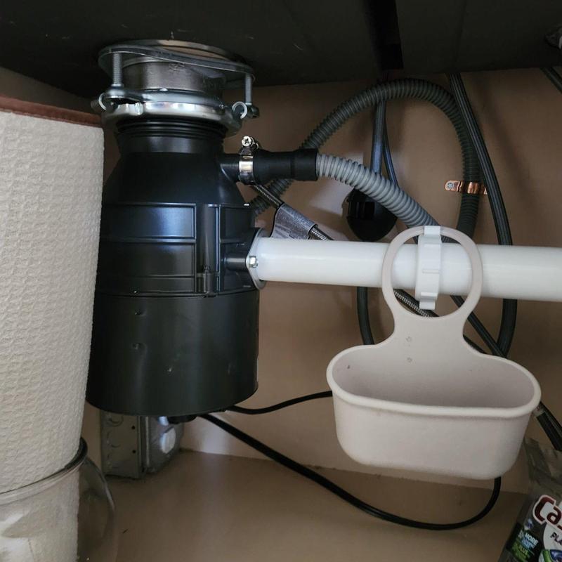 Garbage disposal and dishwasher drain plug under sink
