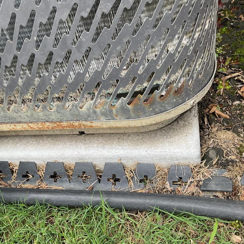 Downstairs condenser coil corrosion on HVAC unit exterior Downstairs condenser coil corrosion on HVAC unit exterior
