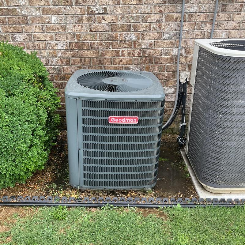 Downstairs condenser coil with corrosion near brick wall Downstairs condenser coil with corrosion near brick wall