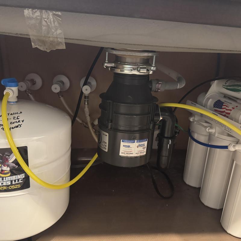 Reverse osmosis system with garbage disposal installed under sink
