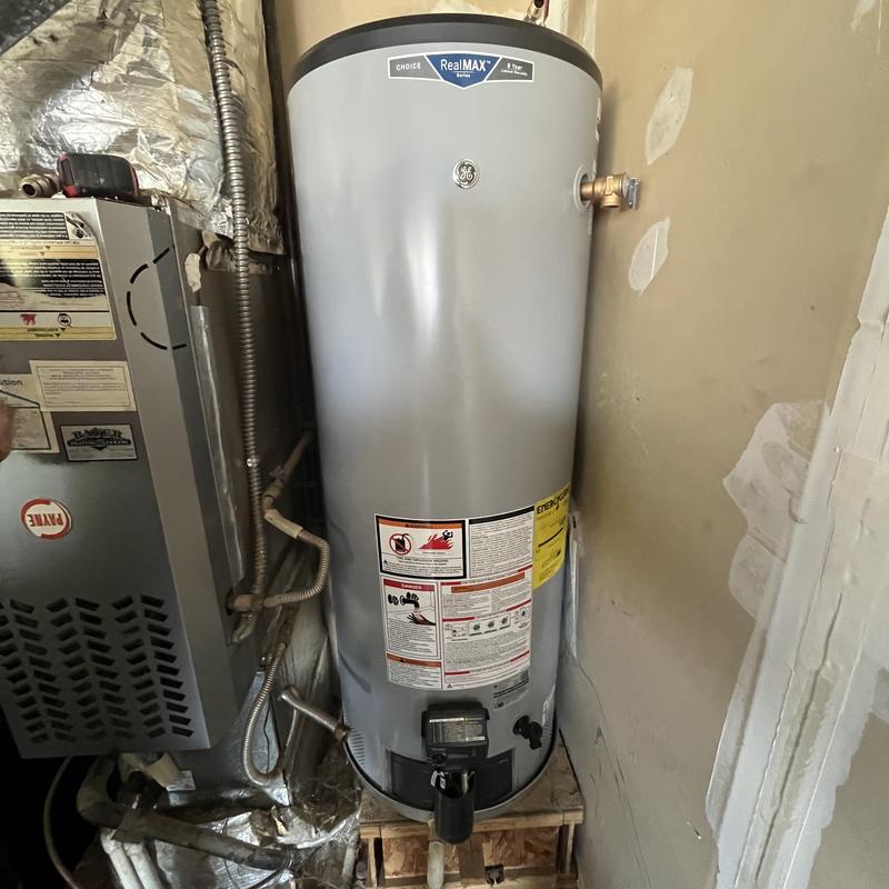 Gas water heater with expansion tank installation in corner Gas water heater with expansion tank installation in corner