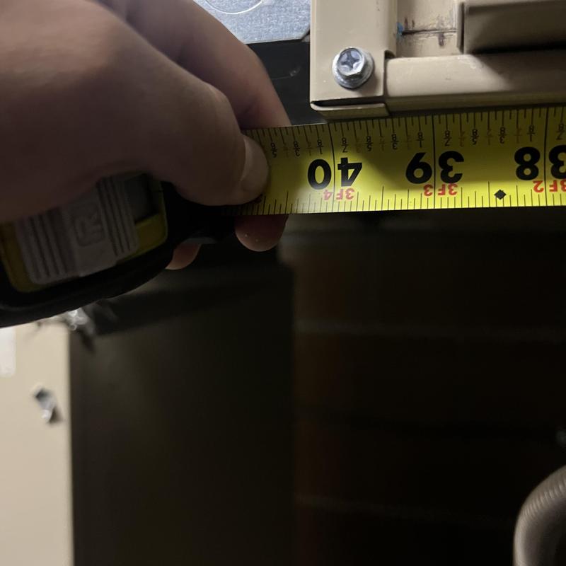 Furnace housing width measurement with tape measure Furnace housing width measurement with tape measure
