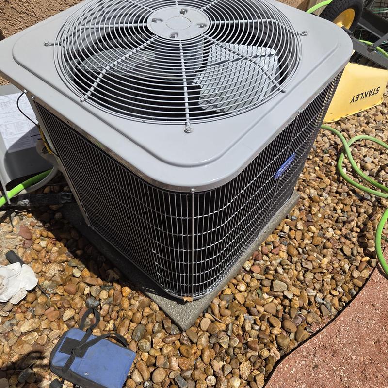 AC condenser unit exterior cleaning on gravel bed AC condenser unit exterior cleaning on gravel bed