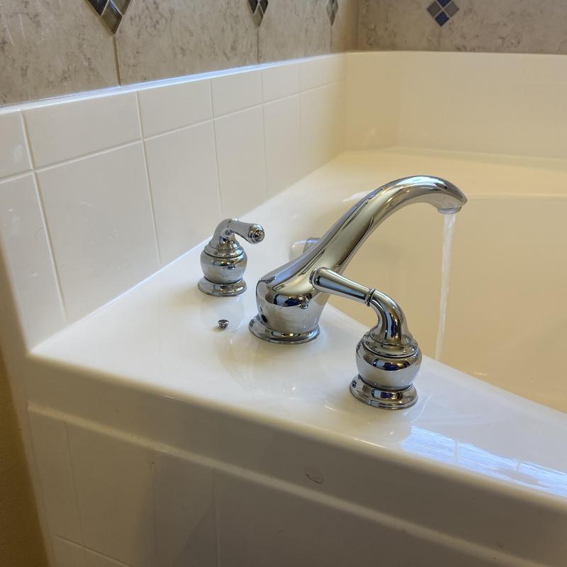 Tub faucet with water flow in master bathroom
