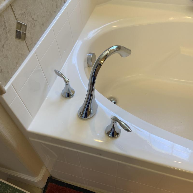 Tub faucet and handles on master bathroom tub
