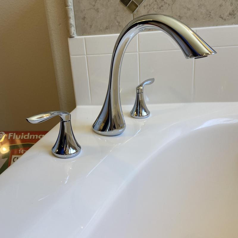 Tub faucet and handles in master bathroom sink