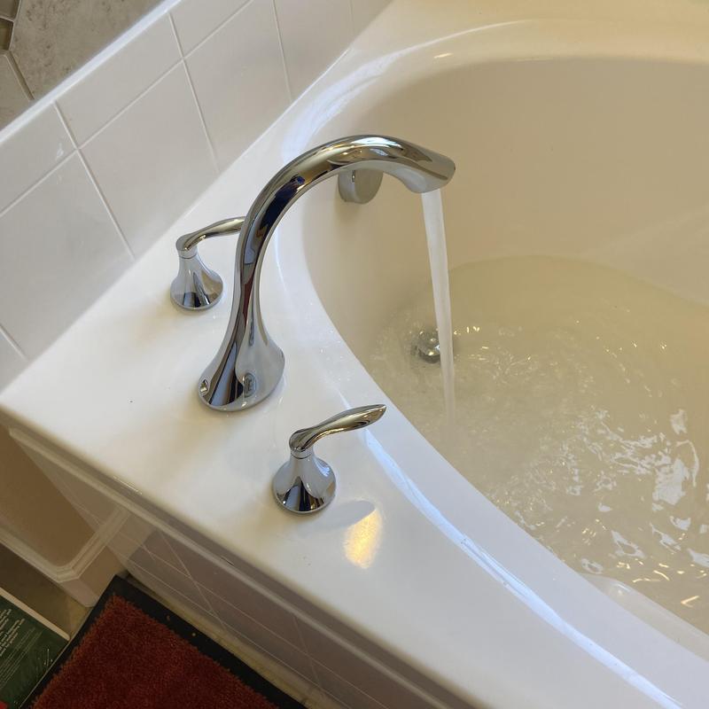 Tub faucet with running water in master bathroom
