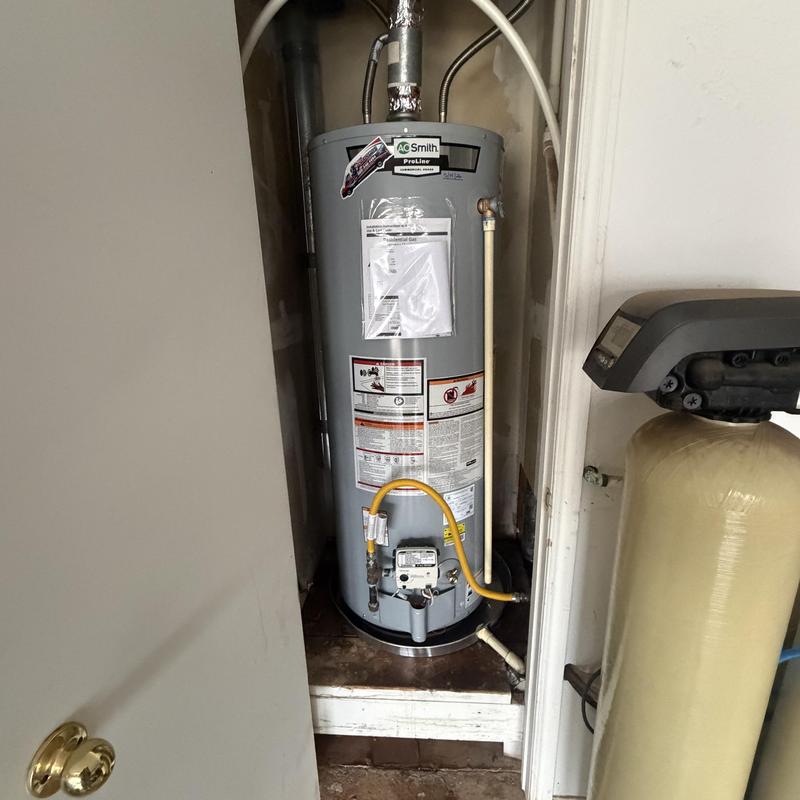 AO Smith natural gas water heater installation in utility closet AO Smith natural gas water heater installation in utility closet