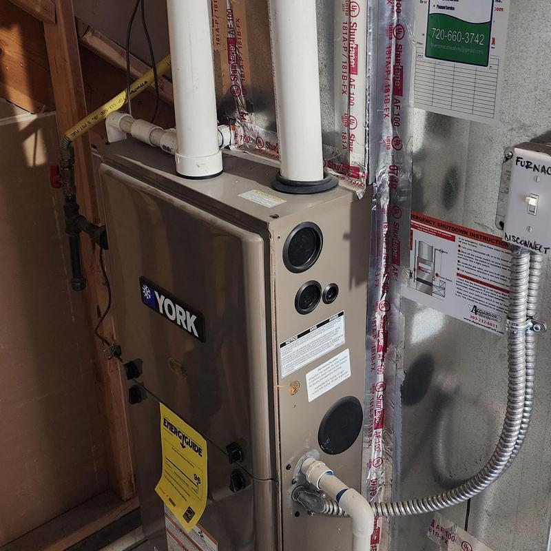 York furnace with vent pipes and power disconnect switch