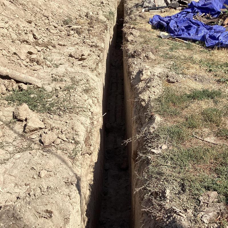 Sewer main trench excavation near home footing Sewer main trench excavation near home footing