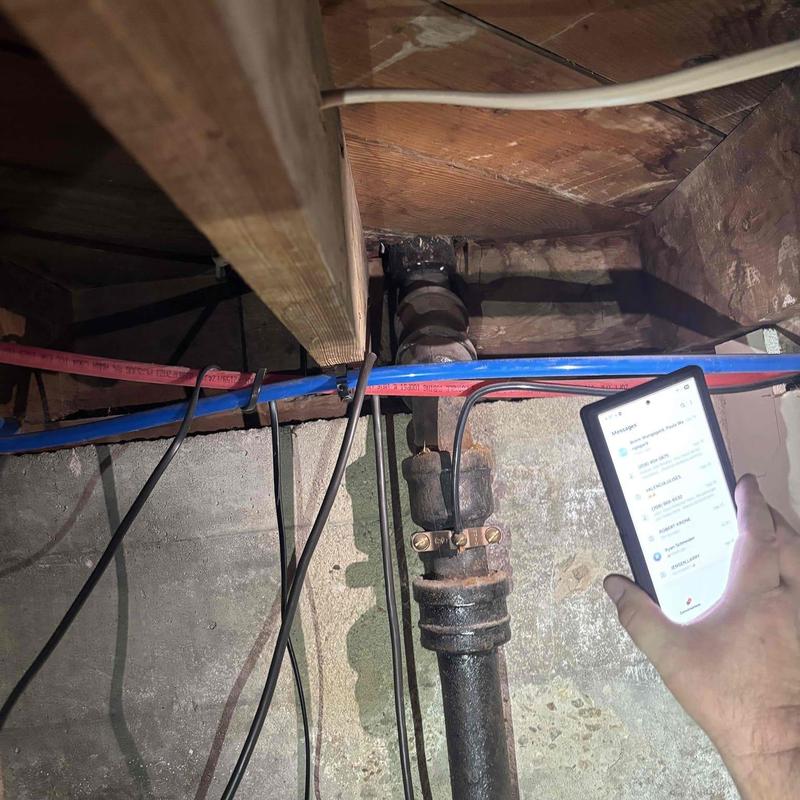 Sink drain pipe blockage cleared with cable tool