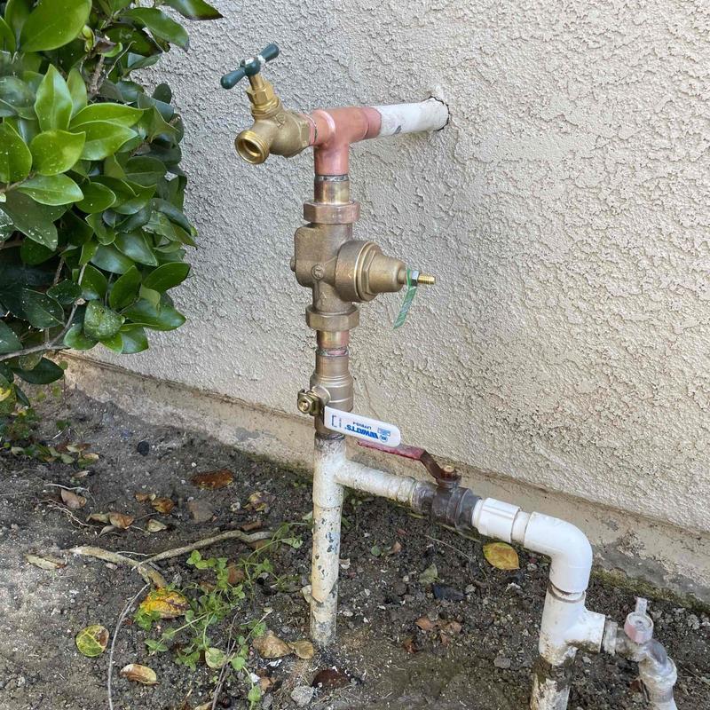 Pressure regulator and outdoor spigot on pipe system