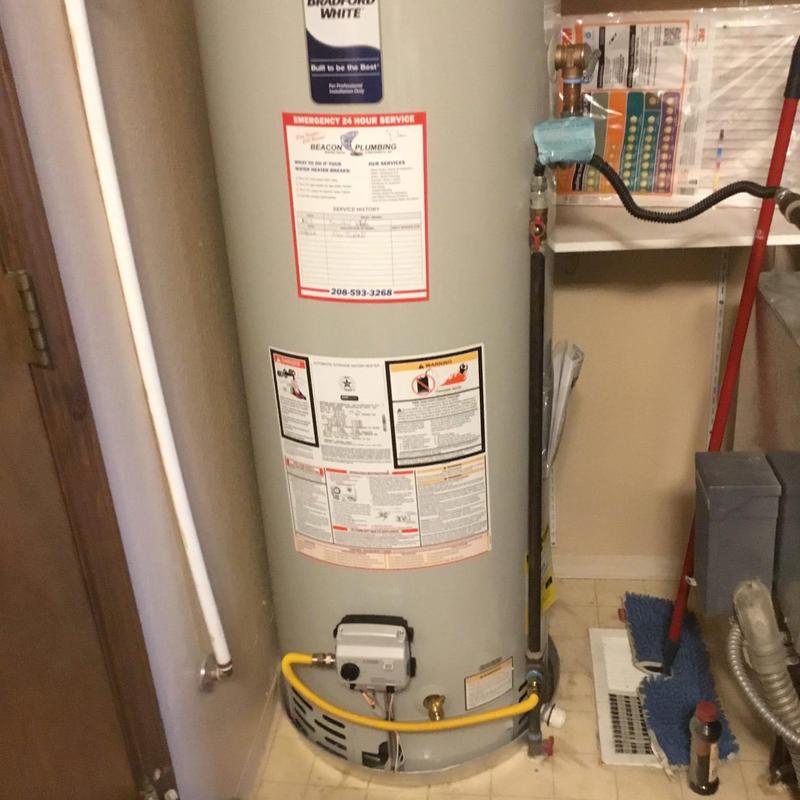 Gas water heater with leaking t&p valve in utility room Gas water heater with leaking t&p valve in utility room