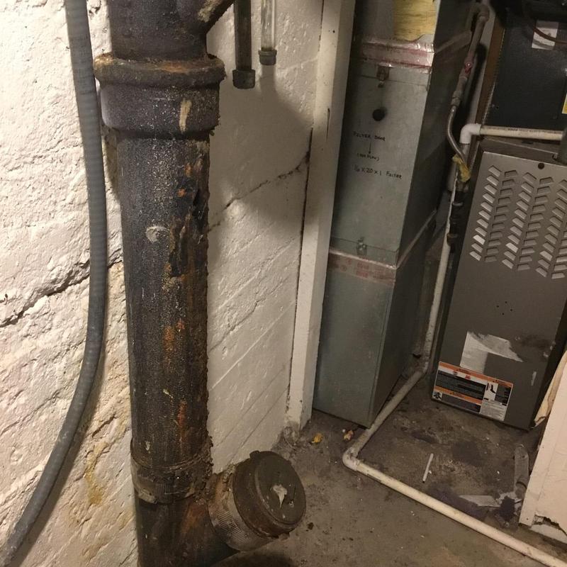 Cast iron drain pipe with rust and corrosion buildup Cast iron drain pipe with rust and corrosion buildup