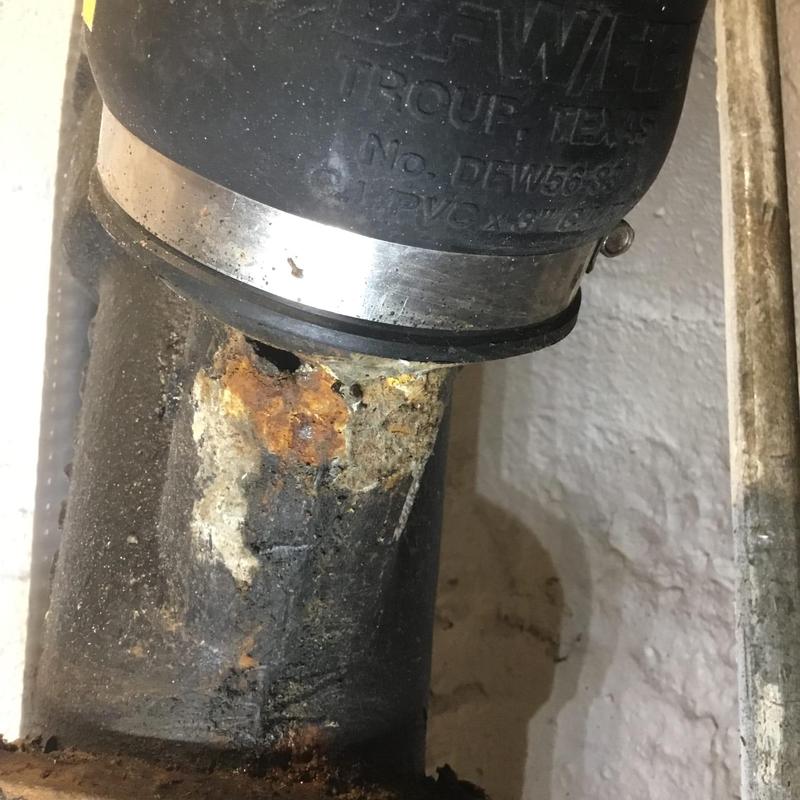 Corroded cast iron pipe joint with clamp repair Corroded cast iron pipe joint with clamp repair