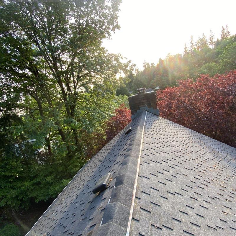 Roof ridge and flapper vent with new shingles
