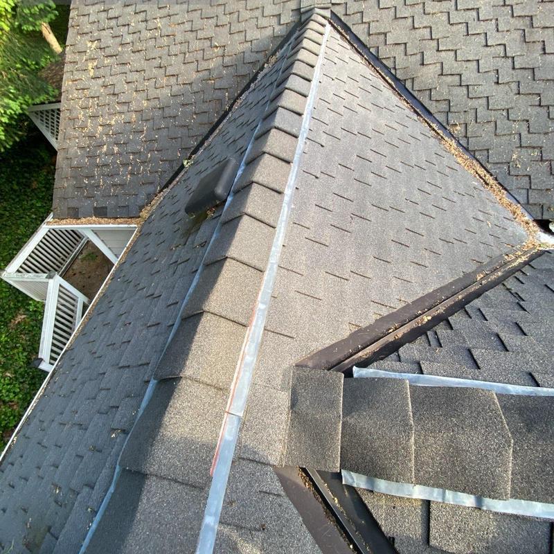 Roof ridge and flapper vent installation on asphalt roof