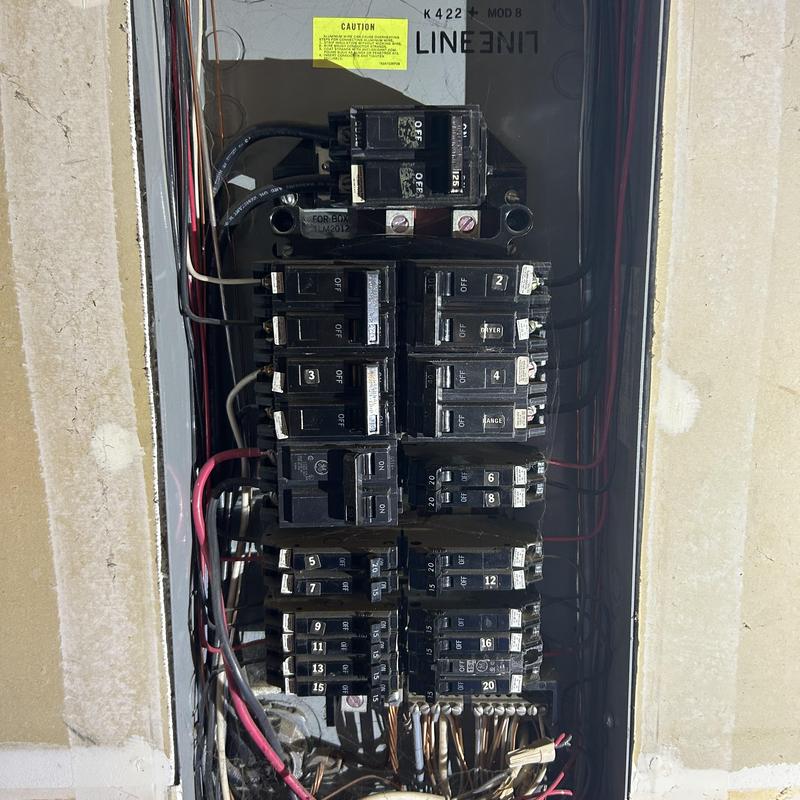 Electrical breaker panel with labeled circuit breakers