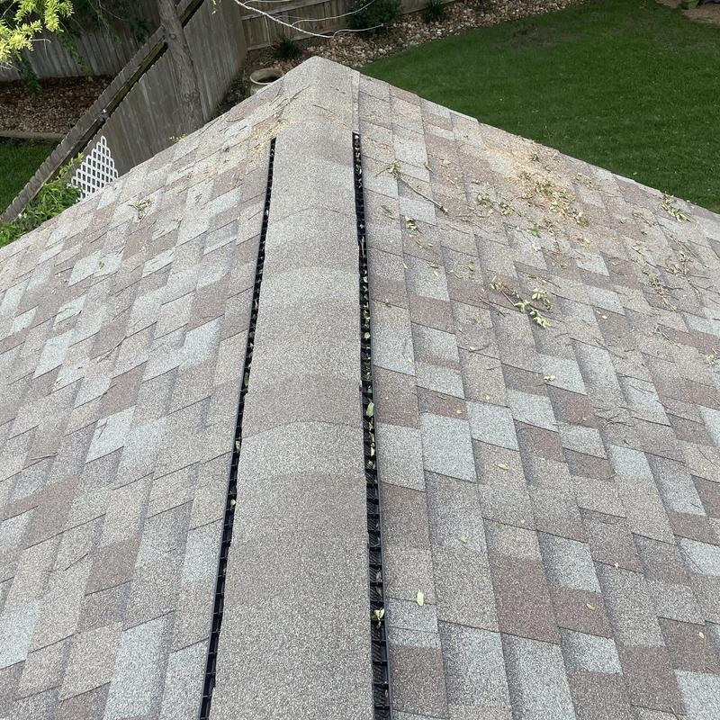 Asphalt shingle roof with cleared debris after tree limb removal Asphalt shingle roof with cleared debris after tree limb removal