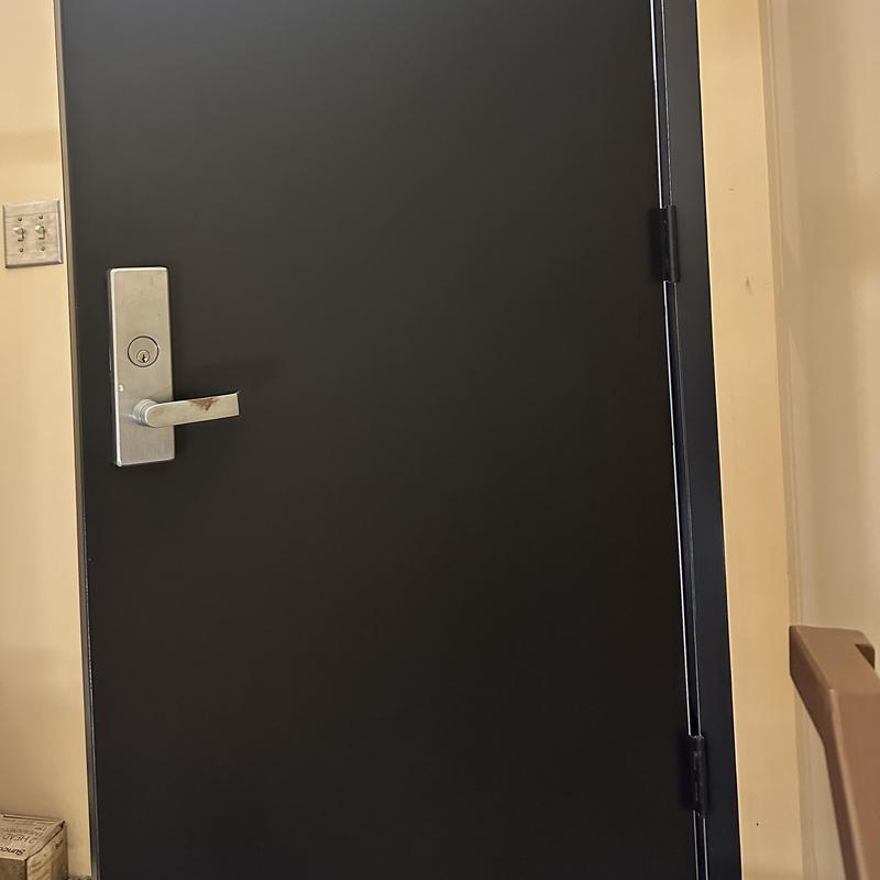 Exit device door with lever handle and lock installed Exit device door with lever handle and lock installed