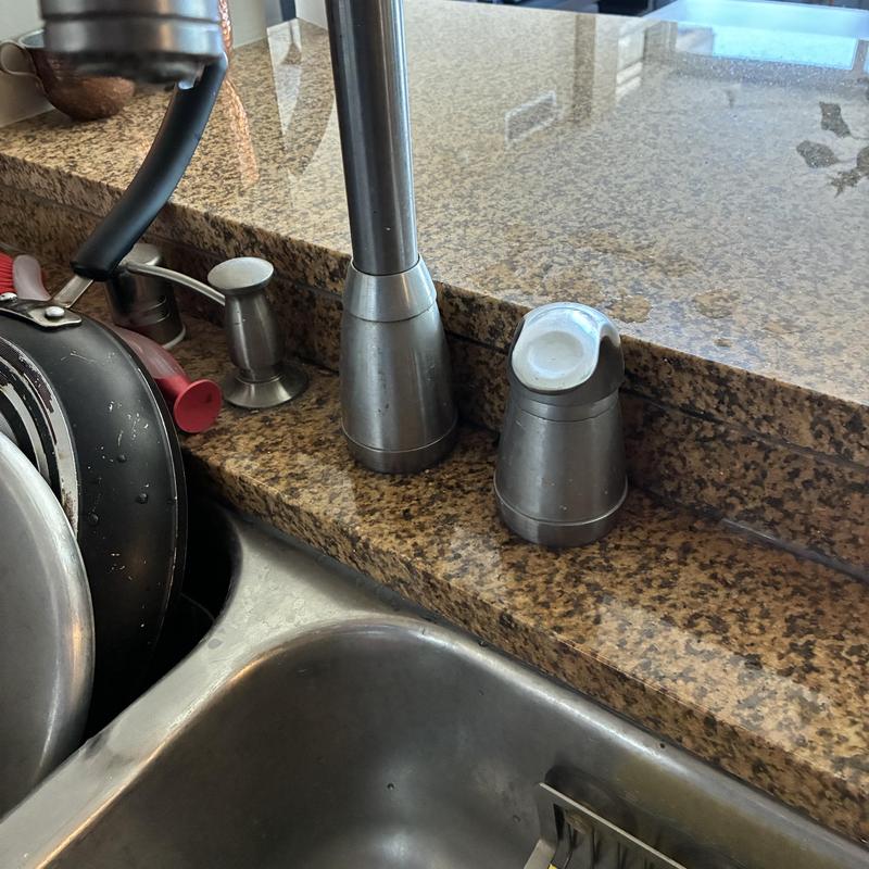 Kitchen faucet and sink sealing on granite countertop