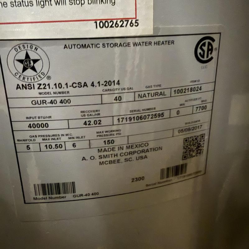 Water heater label showing model and specs details