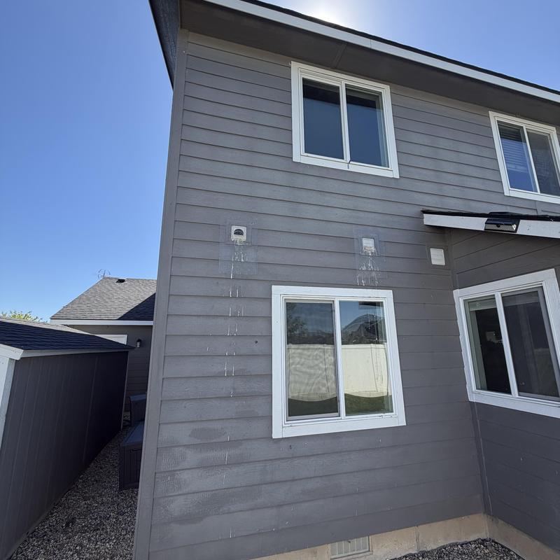 Exhaust duct vents on exterior wall with staining Exhaust duct vents on exterior wall with staining