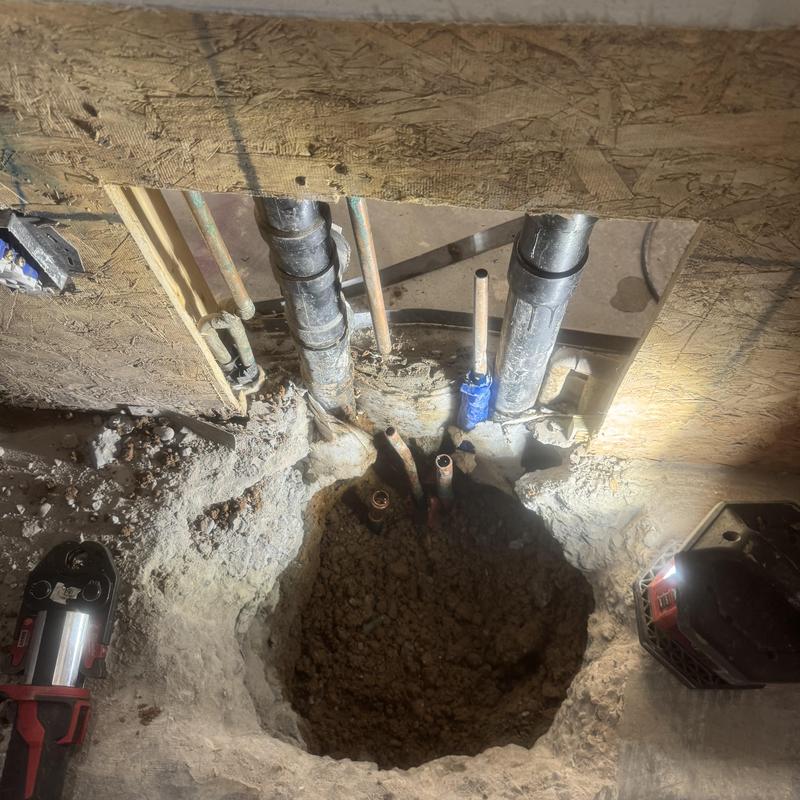 Kitchen slab pipe exposed beneath post tension slab in repair Kitchen slab pipe exposed beneath post tension slab in repair