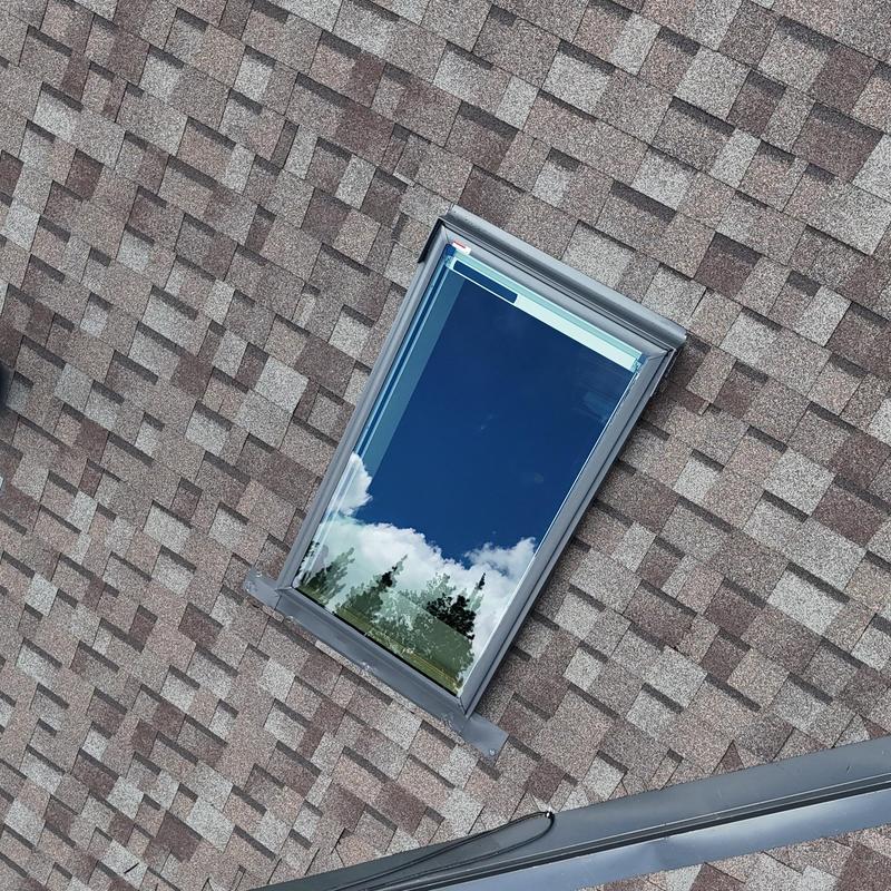 VL Luxe solar shade skylight on shingle roof