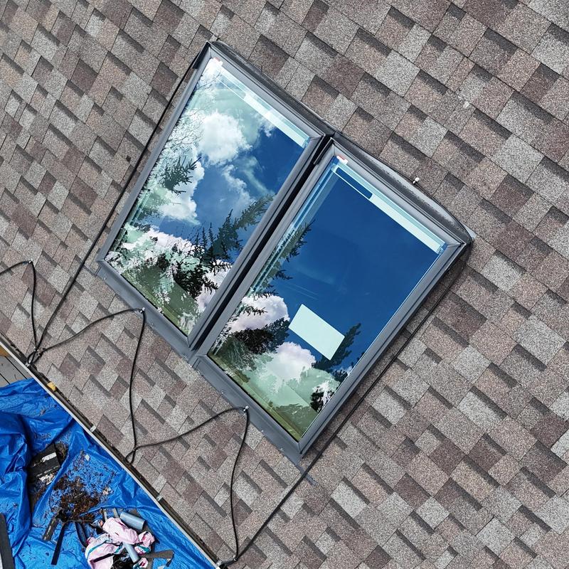 VL Luxe solar shade skylights installation on shingle roof