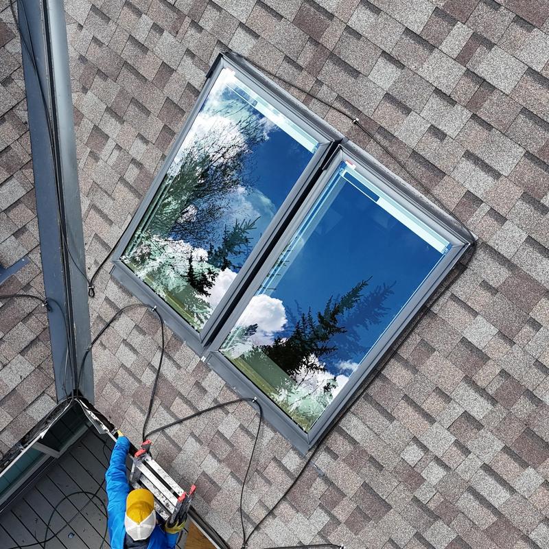 VL Luxe solar shade skylights on shingle roof installation