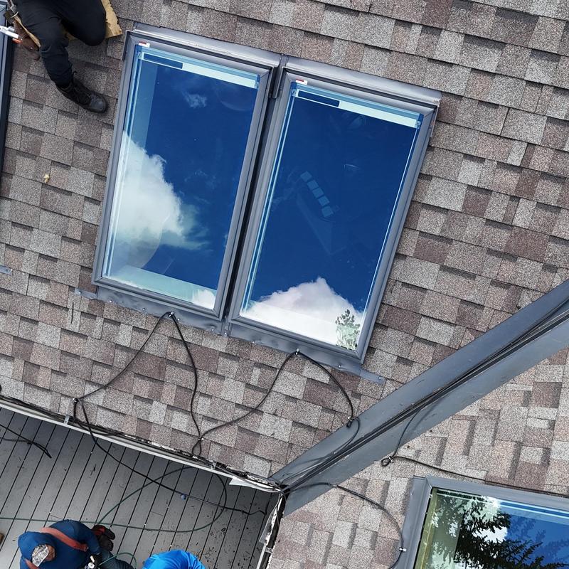 VL Luxe solar shade skylights on shingled roof installation