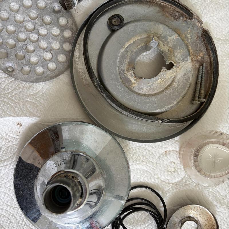 Shower valve parts with corrosion and wear damage Shower valve parts with corrosion and wear damage