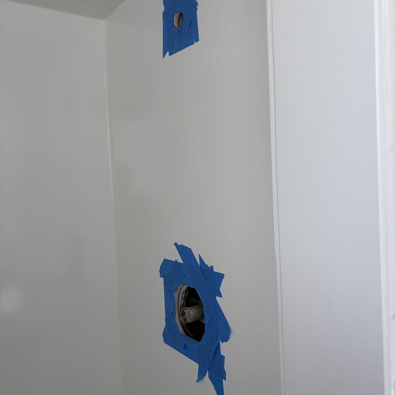 Shower valve rough-in with protective blue tape Shower valve rough-in with protective blue tape
