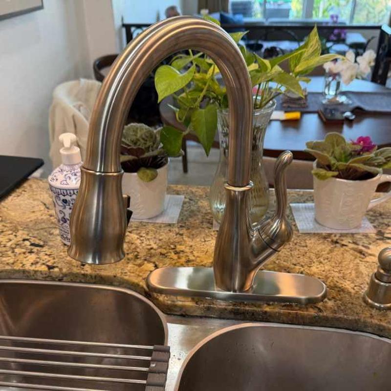 Kitchen faucet installation on granite countertop