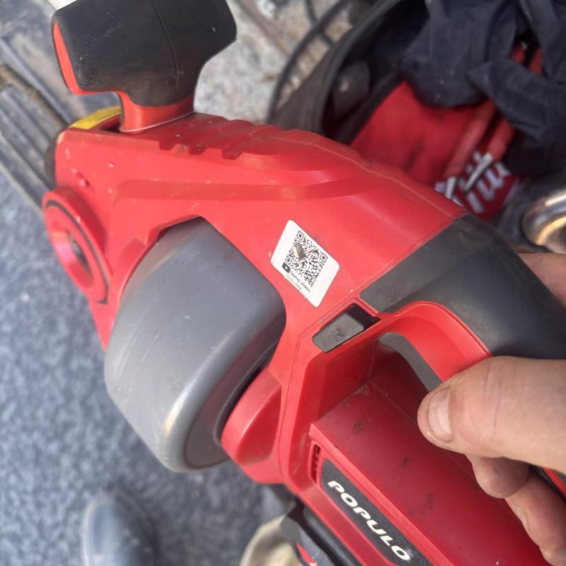 Drain cleaning machine handheld tool close-up in use
