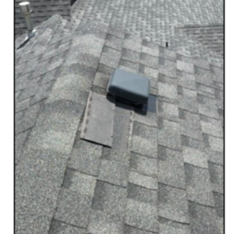 Roof shingles around vent with patching and caulked nails