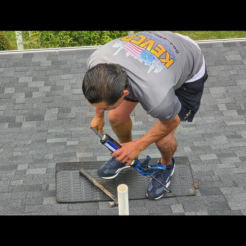 Pipe boot on shingle roof with caulking application