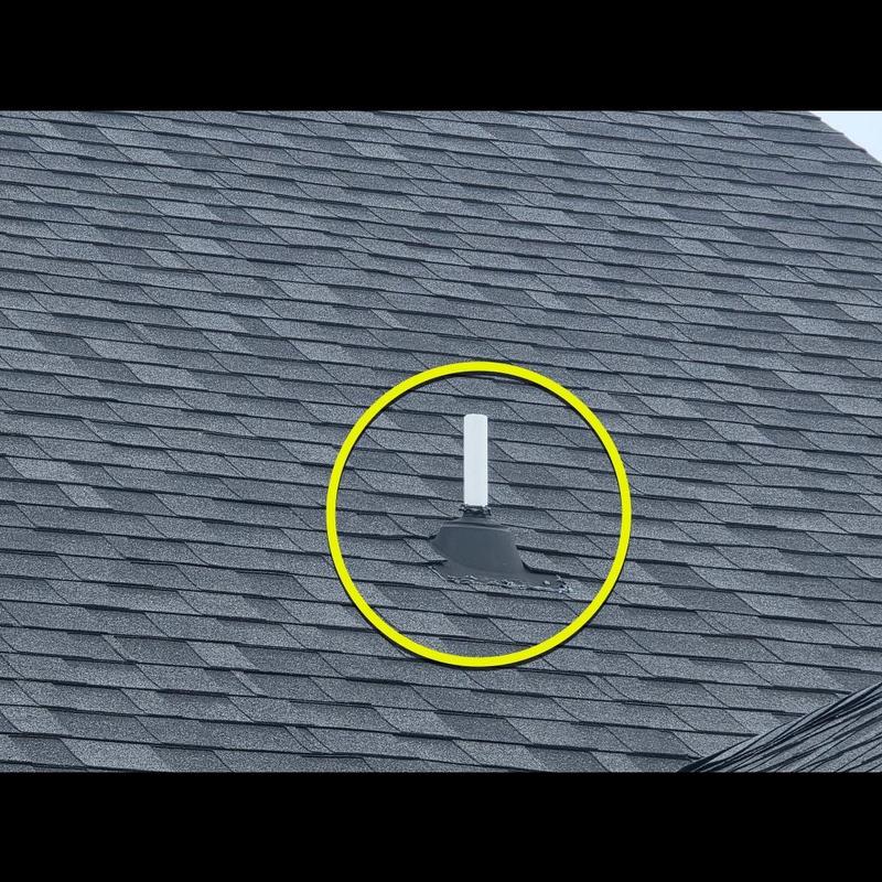 Pipe boot flashing on asphalt shingle roof with damage