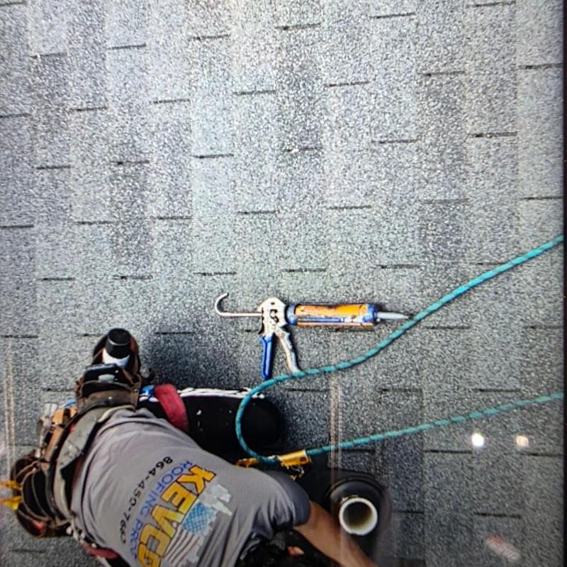 Pipe boot sealant application on shingle roof in Spartanburg