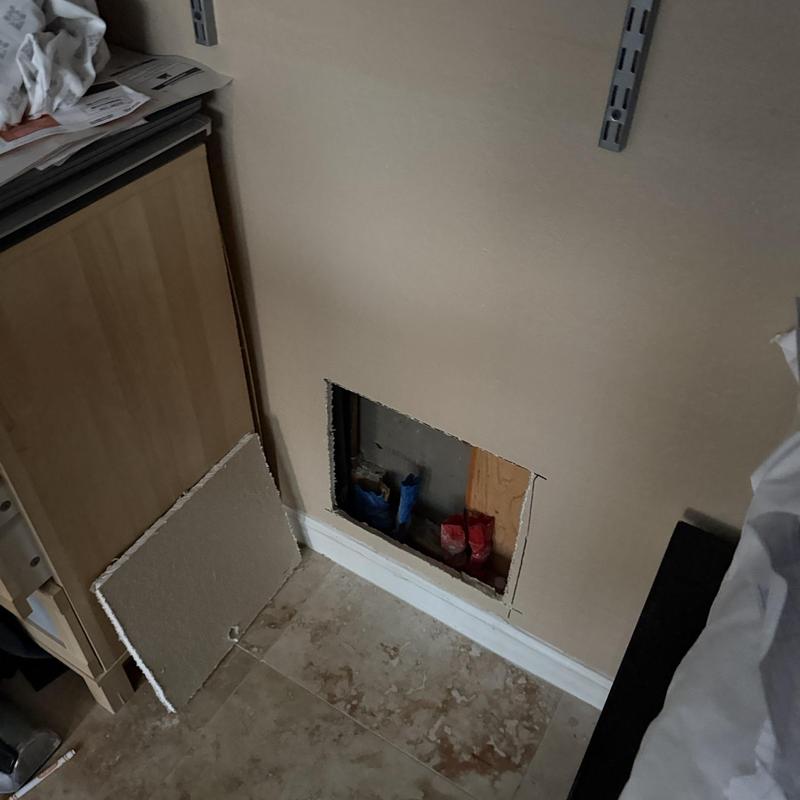 Water line repiping access behind drywall in home wall