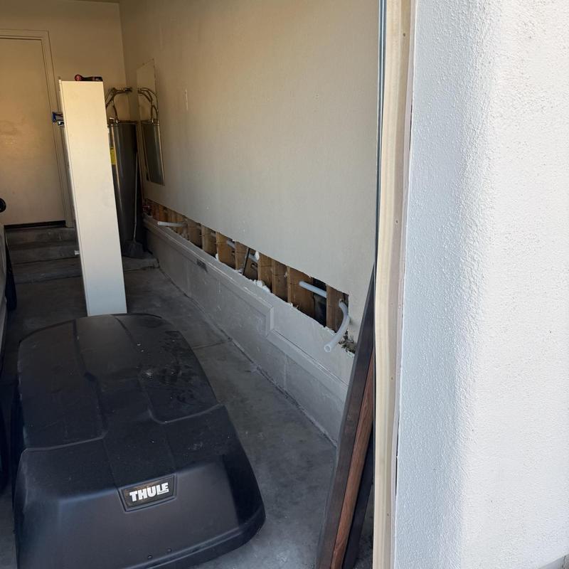 Water line repipe with exposed wall pipes in garage